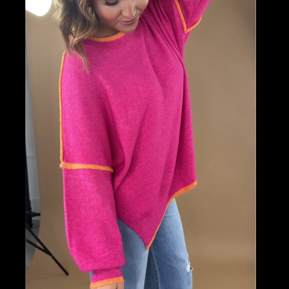 Wear around oversized pink sweater with orange trim